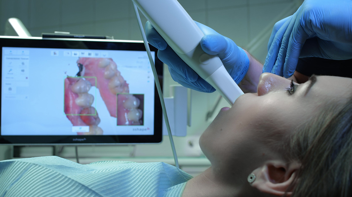 Dentists Scanning Patient with Intraoral Camera